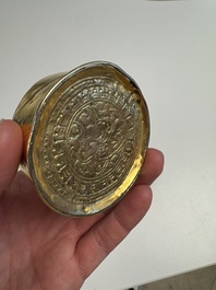 A fine Tibetan gilt-bronze box and cover with repouss&eacute; scroll decoration, 18th C.