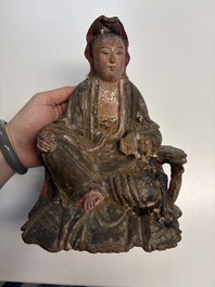 Eight Chinese carved wooden sculptures with traces of polychromy and gilding, 19th C.
