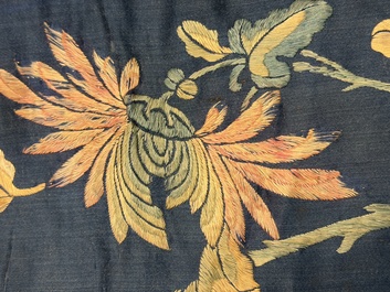 Two Chinese embroidered silk panels with antiquities and birds among flowering branches, 19th C.