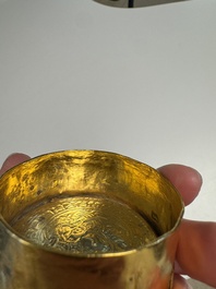 A fine Tibetan gilt-bronze box and cover with repouss&eacute; scroll decoration, 18th C.