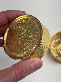 A fine Tibetan gilt-bronze box and cover with repouss&eacute; scroll decoration, 18th C.