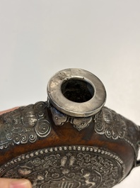 A Tibetan red-coral and malachite-inlaid and silver-mounted 'Ba Ji Xiang' wine bottle, 19th C.