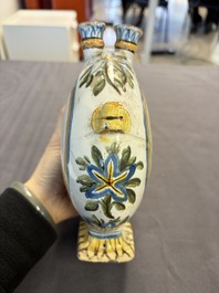 A polychrome Italian maiolica pilgrim bottle with two portrait busts, Castelli, 18th C.