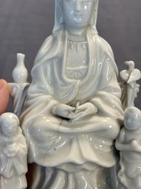 Two Chinese Dehua blanc de Chine groups of Guanyin and a vase with lion-head handles, 18th C. and later