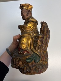 Eight Chinese carved wooden sculptures with traces of polychromy and gilding, 19th C.