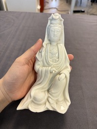Two Chinese Dehua blanc de Chine groups of Guanyin and a vase with lion-head handles, 18th C. and later