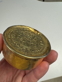 A fine Tibetan gilt-bronze box and cover with repouss&eacute; scroll decoration, 18th C.