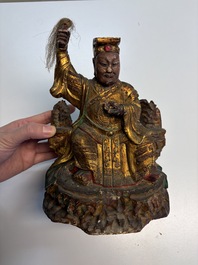 Eight Chinese carved wooden sculptures with traces of polychromy and gilding, 19th C.