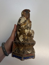 Eight Chinese carved wooden sculptures with traces of polychromy and gilding, 19th C.
