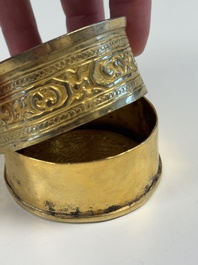 A fine Tibetan gilt-bronze box and cover with repouss&eacute; scroll decoration, 18th C.