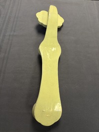A large Chinese lemon-yellow-glazed biscuit 'Dragons' ruyi in the style of Wang Bingrong, on a wooden stand, Republic