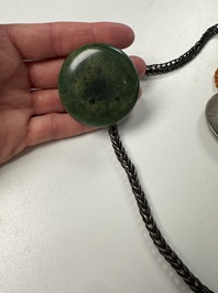 A Tibetan red-coral and malachite-inlaid and silver-mounted 'Ba Ji Xiang' wine bottle, 19th C.