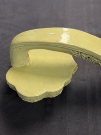 A large Chinese lemon-yellow-glazed biscuit 'Dragons' ruyi in the style of Wang Bingrong, on a wooden stand, Republic
