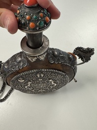 A Tibetan red-coral and malachite-inlaid and silver-mounted 'Ba Ji Xiang' wine bottle, 19th C.