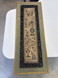 Two Chinese embroidered silk panels with antiquities and birds among flowering branches, 19th C.