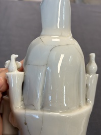 Two Chinese Dehua blanc de Chine groups of Guanyin and a vase with lion-head handles, 18th C. and later