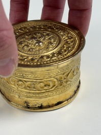 A fine Tibetan gilt-bronze box and cover with repouss&eacute; scroll decoration, 18th C.