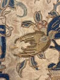 Two Chinese embroidered silk panels with antiquities and birds among flowering branches, 19th C.