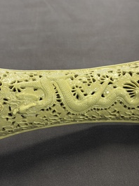 A large Chinese lemon-yellow-glazed biscuit 'Dragons' ruyi in the style of Wang Bingrong, on a wooden stand, Republic