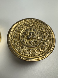 A fine Tibetan gilt-bronze box and cover with repouss&eacute; scroll decoration, 18th C.