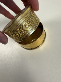 A fine Tibetan gilt-bronze box and cover with repouss&eacute; scroll decoration, 18th C.
