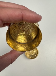 A fine Tibetan gilt-bronze box and cover with repouss&eacute; scroll decoration, 18th C.