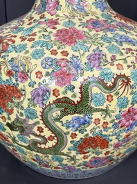A Chinese famille rose yellow-ground 'Tianqiu Ping' vase with dragons and flowers, 20th C.