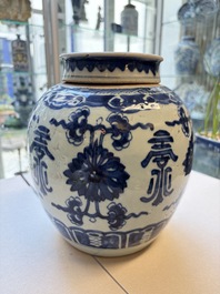 A Chinese blue and white covered jar and two polychrome-decorated jarlets with wooden covers, 18/19th C.