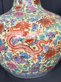 A Chinese famille rose yellow-ground 'Tianqiu Ping' vase with dragons and flowers, 20th C.