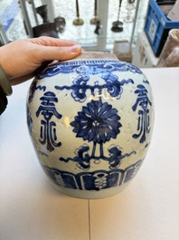 A Chinese blue and white covered jar and two polychrome-decorated jarlets with wooden covers, 18/19th C.