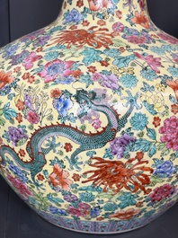 A Chinese famille rose yellow-ground 'Tianqiu Ping' vase with dragons and flowers, 20th C.