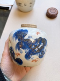 A Chinese blue and white covered jar and two polychrome-decorated jarlets with wooden covers, 18/19th C.