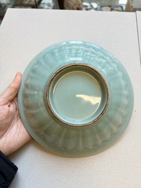 A pair of Chinese white-glazed 'Hu' vases and a Longquan celadon 'Twin Fish' plate, 20th C.