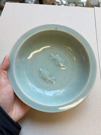 A pair of Chinese white-glazed 'Hu' vases and a Longquan celadon 'Twin Fish' plate, 20th C.