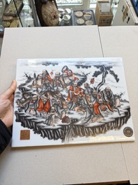A Chinese grisaille and iron-red decorated '18 Luohan' plaque, Qianlong mark, 20th C.