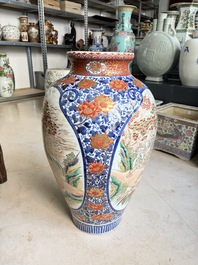A large Japanese Imari 'Shishi Lions' vase, Kutani Taniguchi 九谷 谷口 mark, Meiji, 19th C.