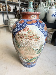 A large Japanese Imari 'Shishi Lions' vase, Kutani Taniguchi 九谷 谷口 mark, Meiji, 19th C.