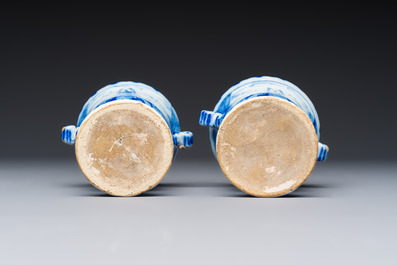 A pair of small blue and white Dutch Delft urn-shaped hyacinth vases, 18th C.