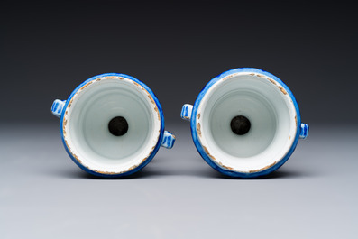 A pair of small blue and white Dutch Delft urn-shaped hyacinth vases, 18th C.