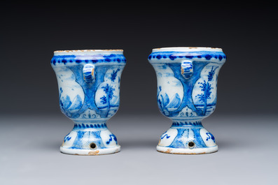A pair of small blue and white Dutch Delft urn-shaped hyacinth vases, 18th C.