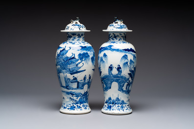 A pair of Chinese blue and white covered vases and two covered jars, Kangxi mark, 19th C