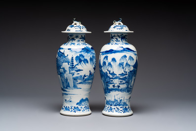 A pair of Chinese blue and white covered vases and two covered jars, Kangxi mark, 19th C