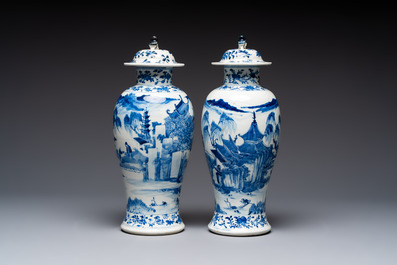 A pair of Chinese blue and white covered vases and two covered jars, Kangxi mark, 19th C