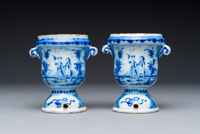 A pair of small blue and white Dutch Delft urn-shaped hyacinth vases, 18th C.