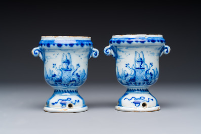 A pair of small blue and white Dutch Delft urn-shaped hyacinth vases, 18th C.