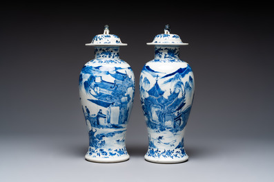 A pair of Chinese blue and white covered vases and two covered jars, Kangxi mark, 19th C
