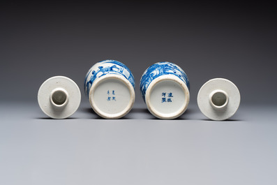 A pair of Chinese blue and white covered vases and two covered jars, Kangxi mark, 19th C
