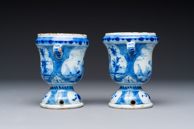 A pair of small blue and white Dutch Delft urn-shaped hyacinth vases, 18th C.