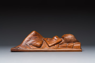 A Balinese carved wooden sculpture of a reclining lady, first half 20th C.