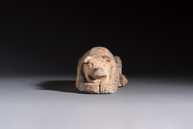 A Chinese grey pottery model of a reclining dog, Han
